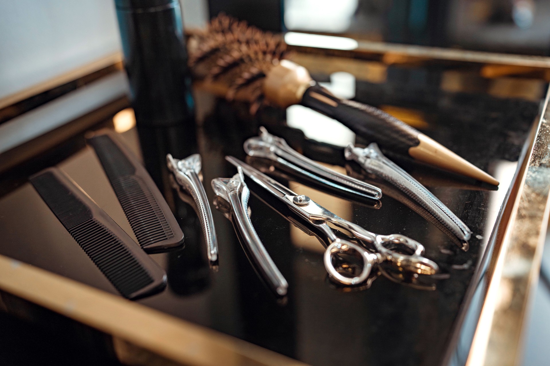 Closeup - Hairdressing scissors and barber accessories in hair salon, Professional tools for haircut in barber shop. Hairdressing concept